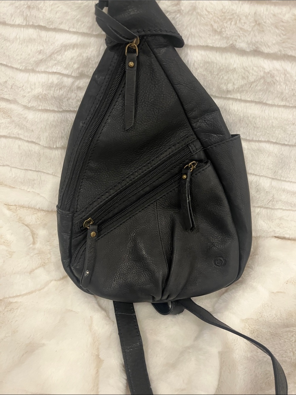 Born Black Leather Sling Backpack with Antique Brass Hardware